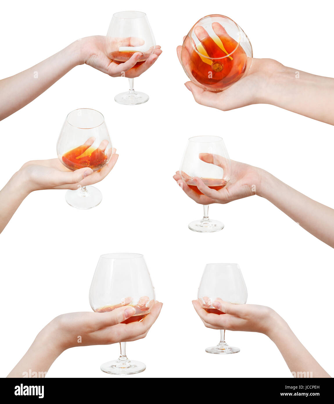 set of hand holds glass goblet with cognac isolated on white background