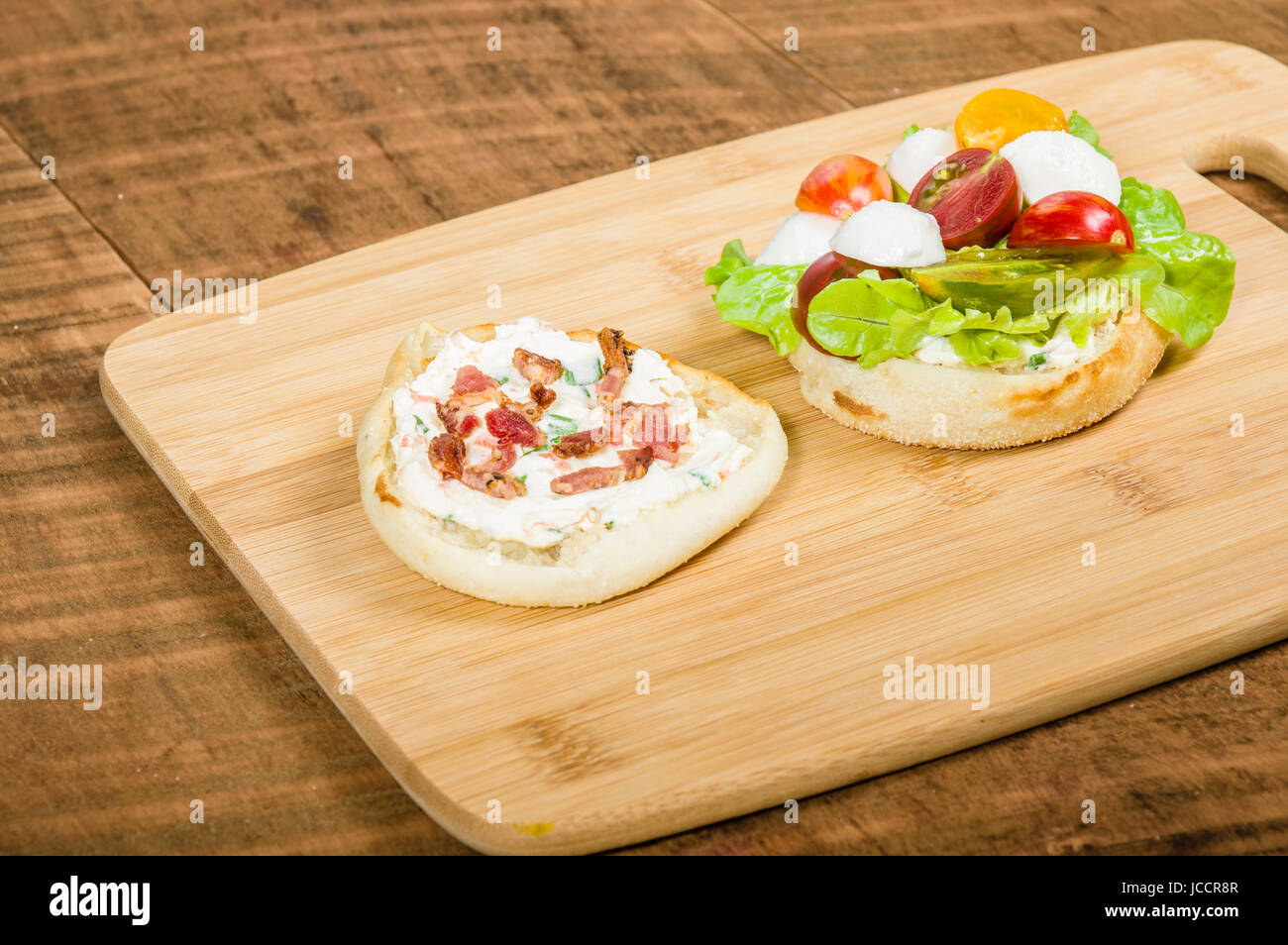 English muffin sandwich with cream cheese and heirloom tomatoes Stock Photo