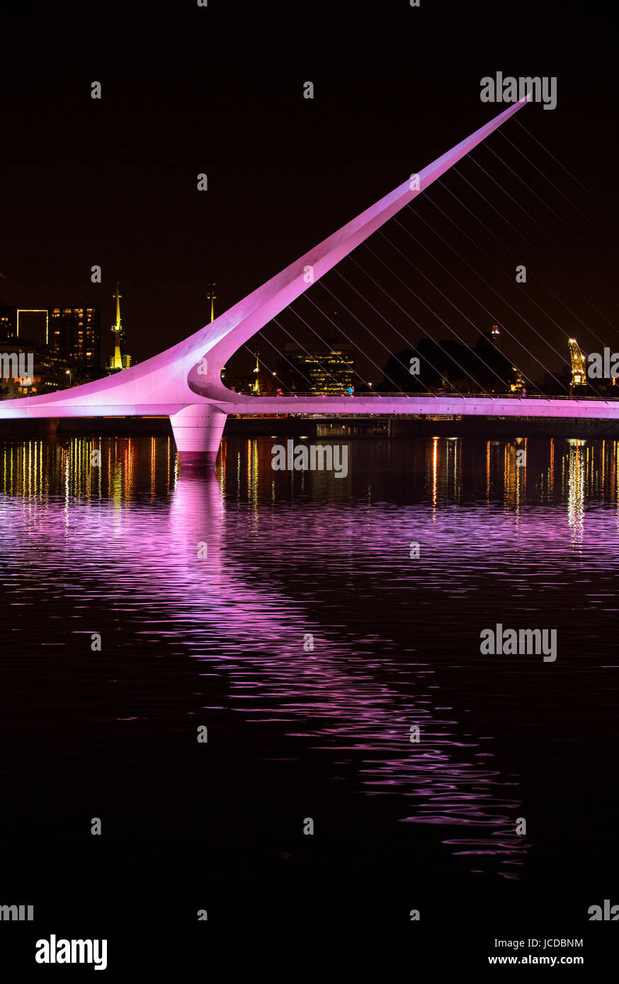 The "Puente de la Mujer" bridge by architect Santiago Calatrava illuminated  by night, Puerto Madero, Buenos Aires, Argentina Stock Photo - Alamy