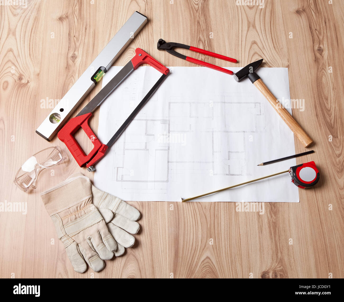 Photo of carpenter tools and building plan Stock Photo - Alamy
