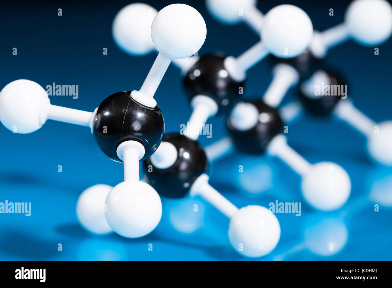 Model of molecular structure on blue reflective background Stock Photo ...