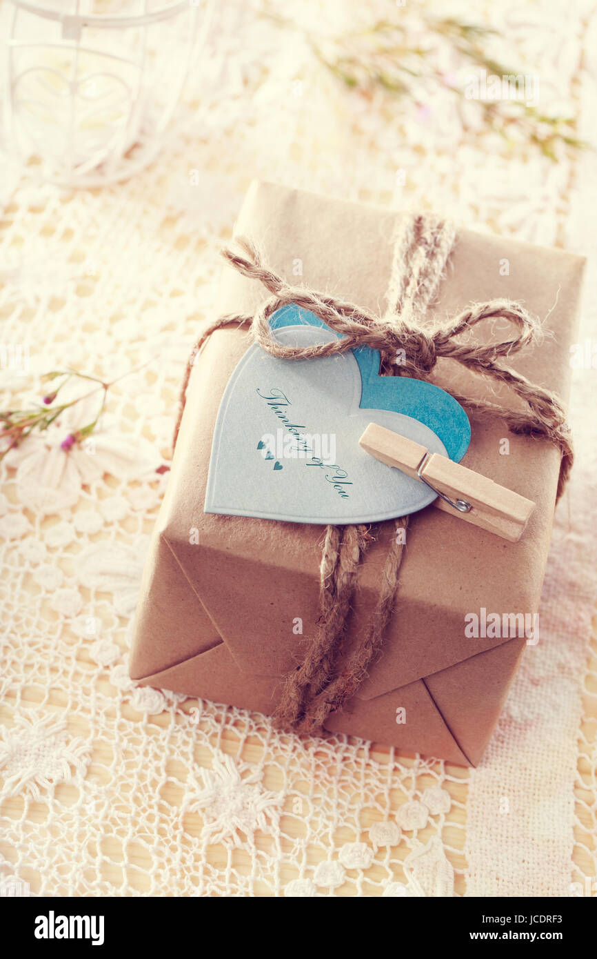 thinking of you message written on heart shaped tags and hand