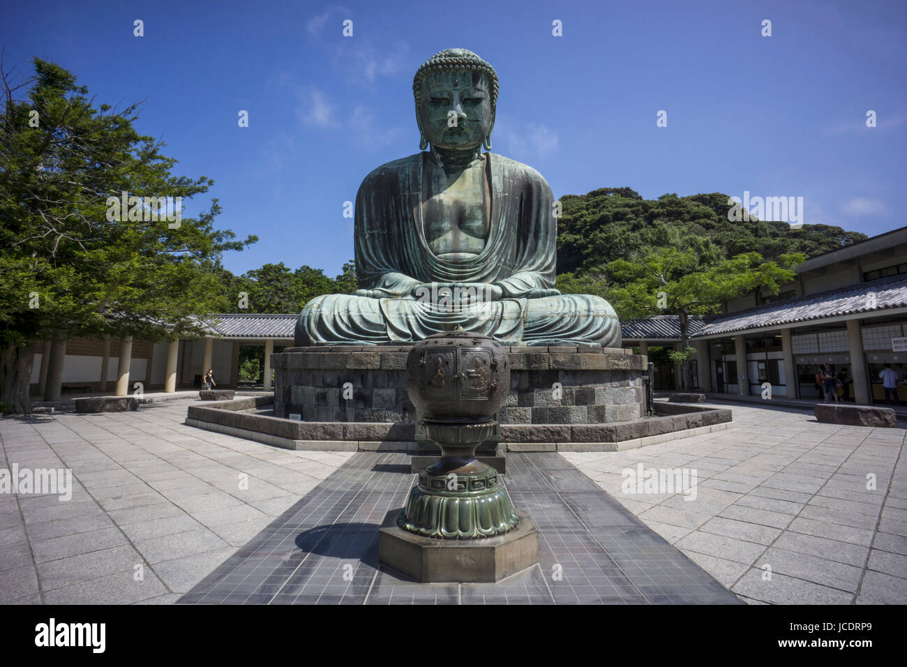 Kamakura, Japan - August 7, 2014: The Great Buddha of Kamakura (Kamakura Daibutsu) is a bronze statue of Amida Buddha, which stands on the grounds of Kotokuin Temple. With a height of 13.35 meters, it is the second tallest bronze Buddha statue in Japan, surpassed only by the statue in Nara's Todaiji Temple. Stock Photo