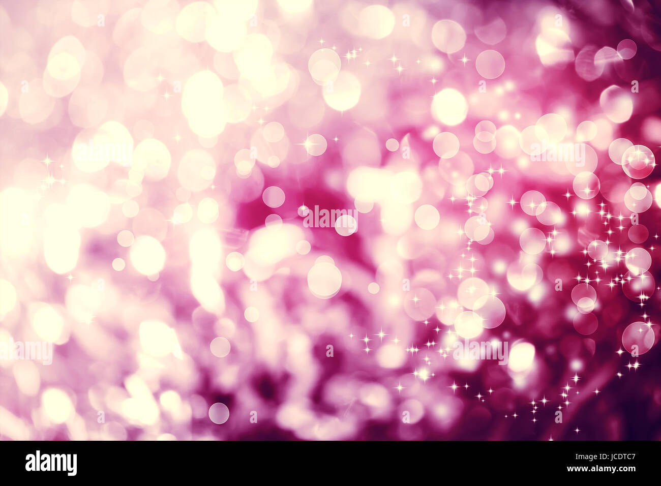 Magenta colored abstract shiny light and glitter background Stock Photo