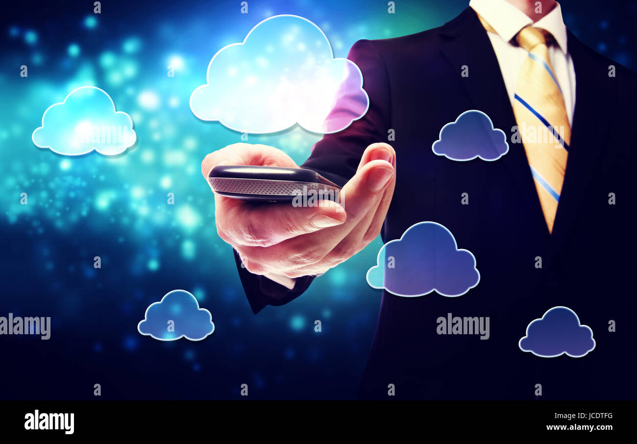 Business man holding a mobile phone with cloud connection concept Stock ...