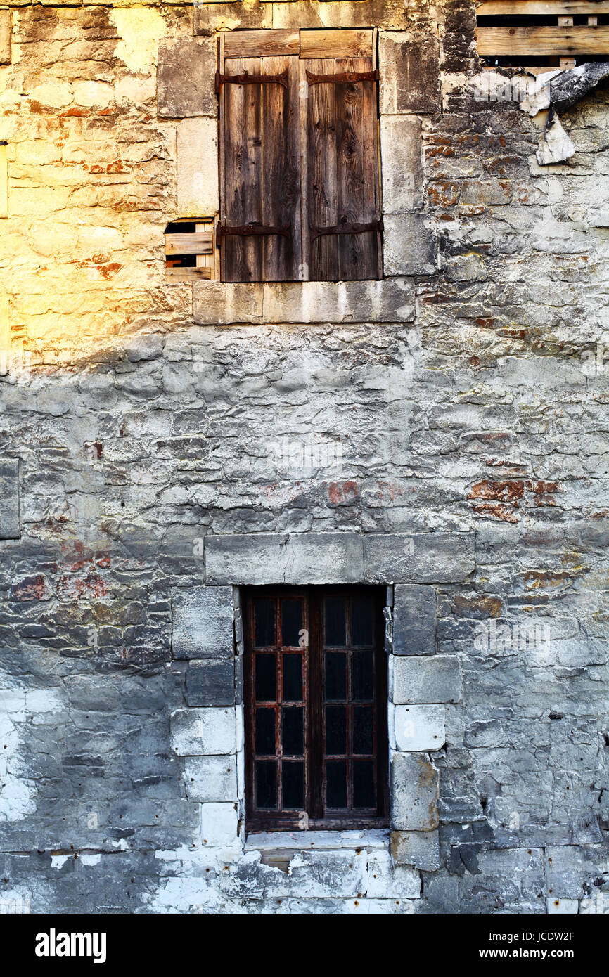 Color shot of an abandoned house wall with windows Stock Photo - Alamy