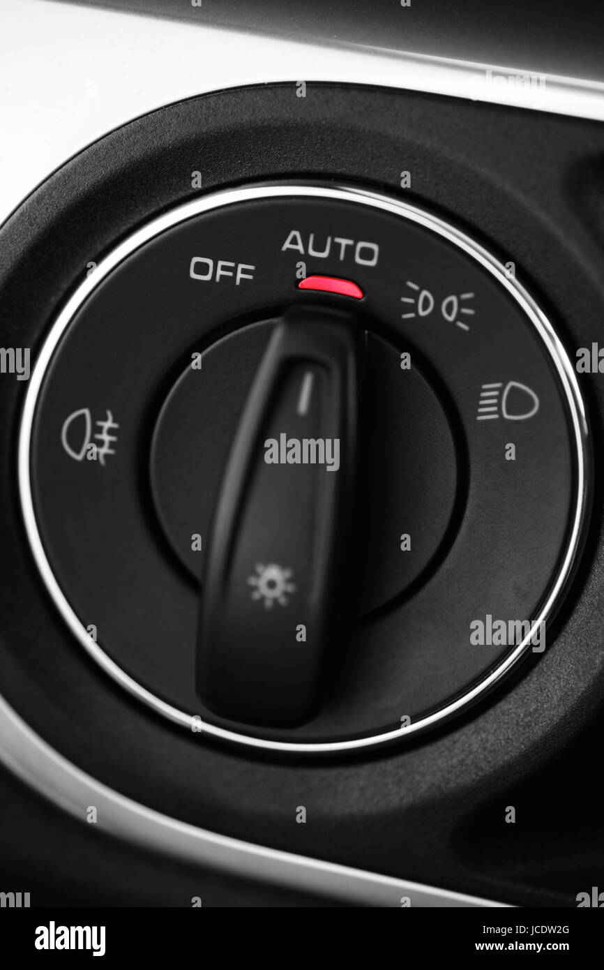 Detail of the headlight button in a car Stock Photo - Alamy