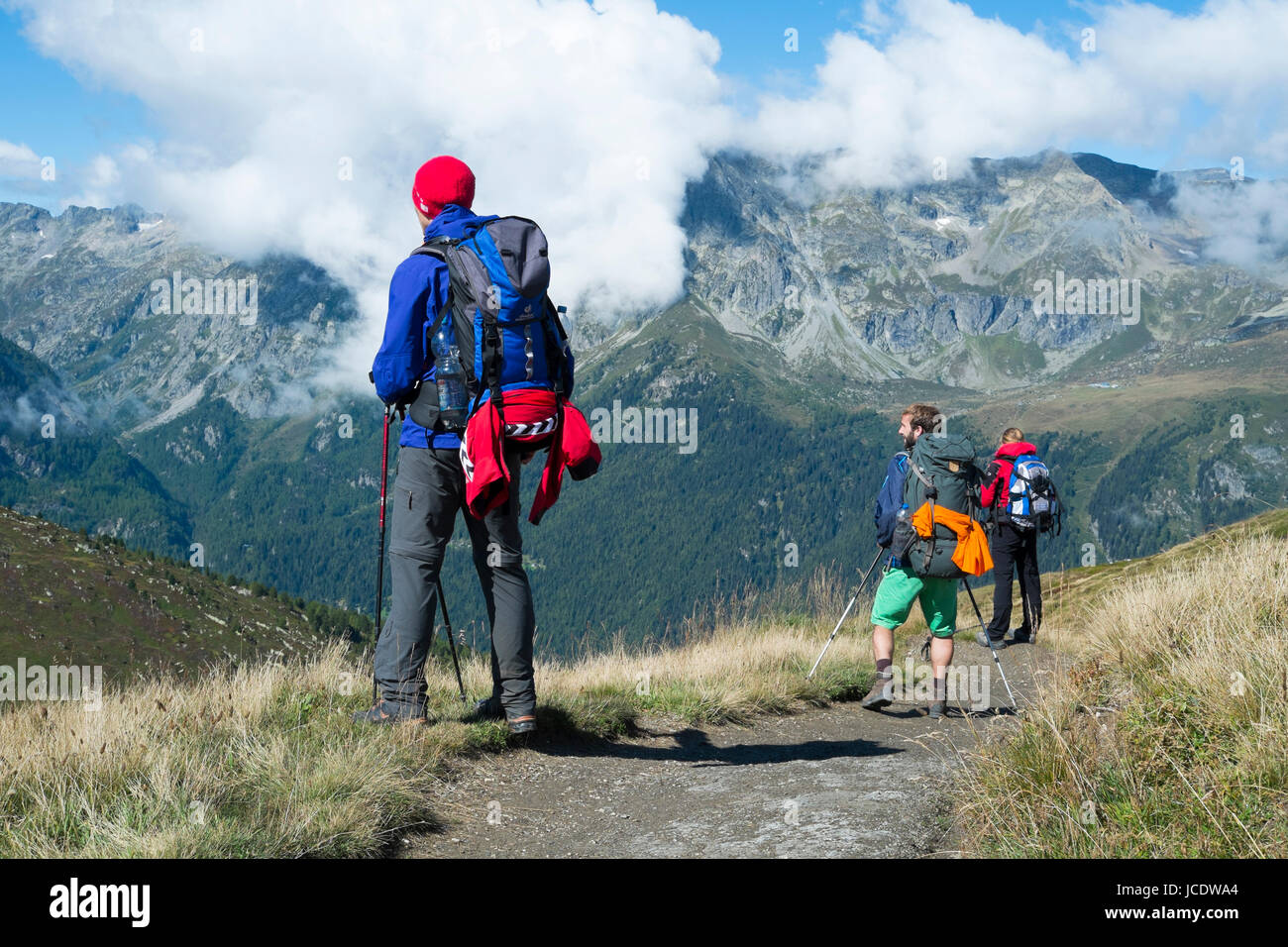 COL DE BALME, FRANCE - SEPTEMBER 01: Backpackers looking at view with Aiguille de Loriaz in the background. The area is a stage of the popular Mont Blanc tour. September 01, 2014 in Col de Balme. Stock Photo