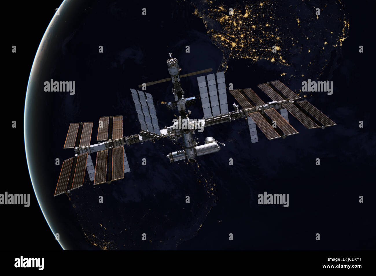 International Space Station over the planet Earth. Elements of this image furnished by NASA. Stock Photo
