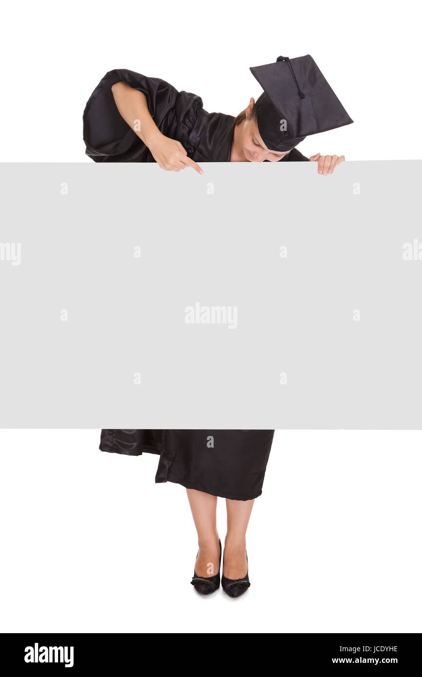 Graduate woman holding blank placard over white background Stock Photo ...