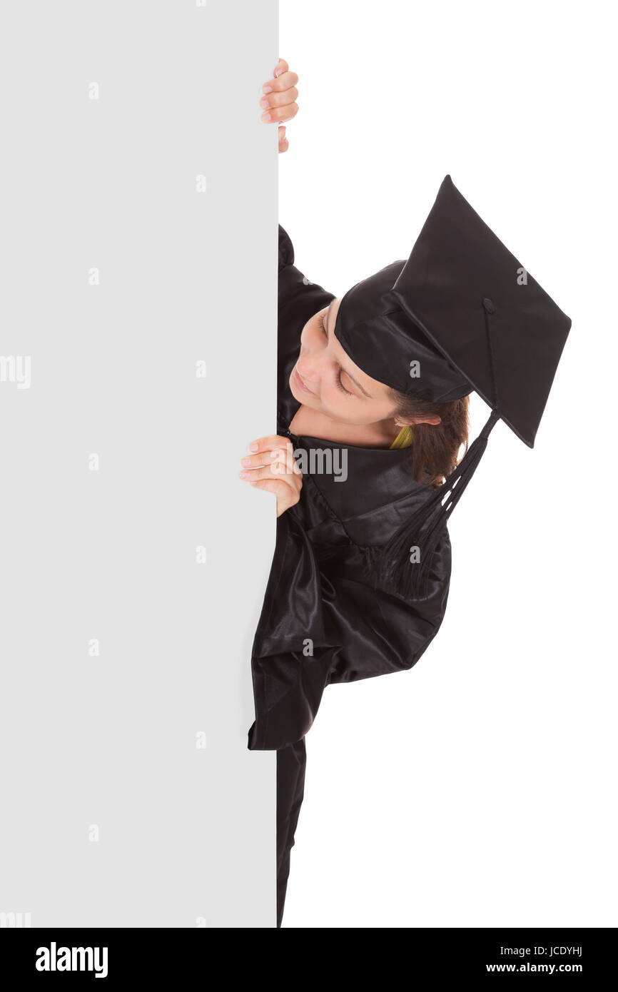 Graduate woman holding blank placard over white background Stock Photo ...