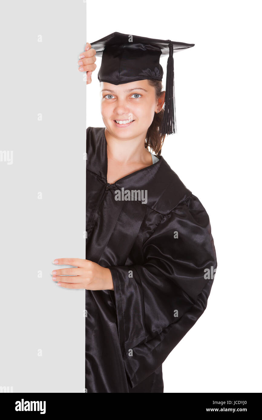 Graduate woman holding blank placard over white background Stock Photo ...