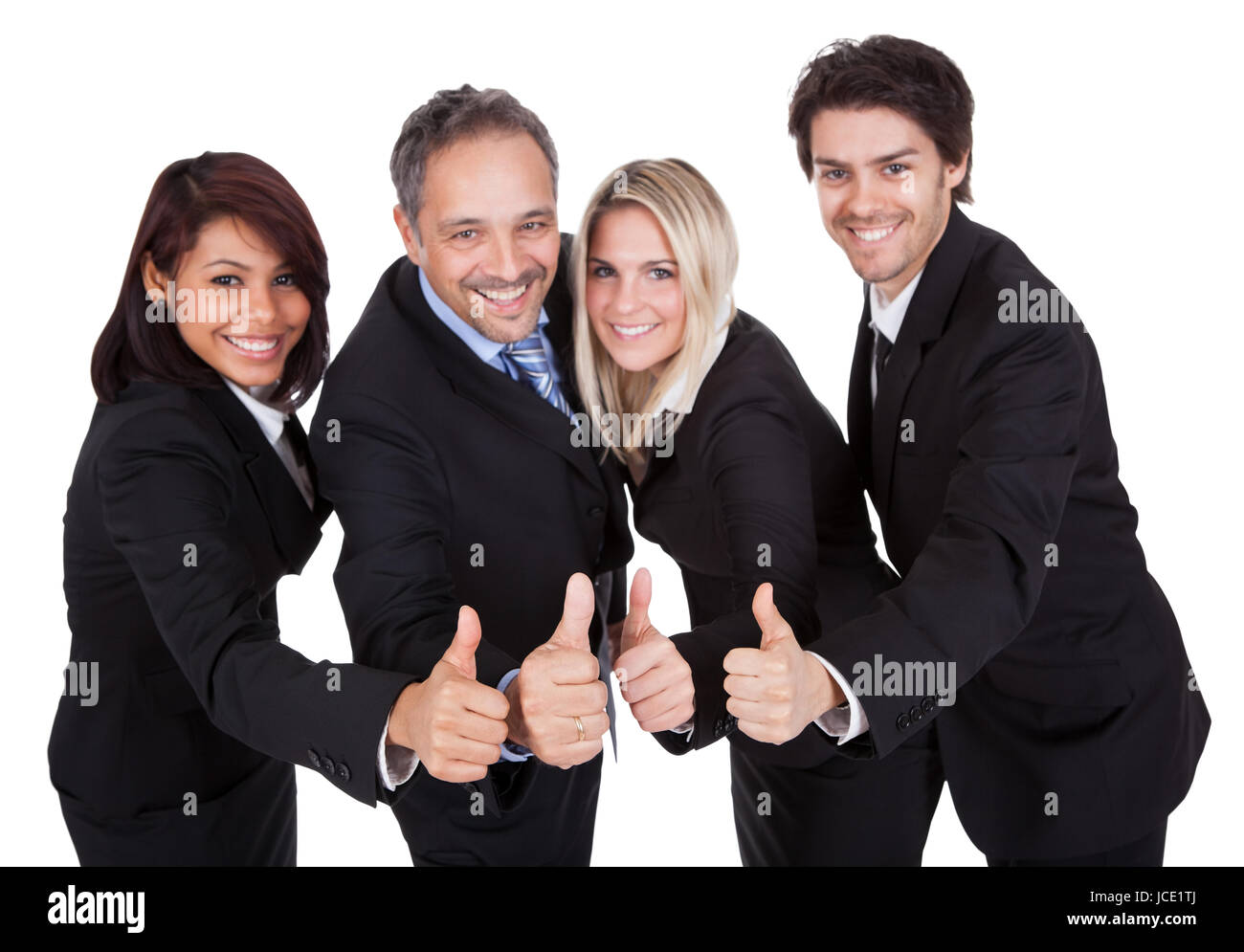 Happy business team celebrating a success with thumbs up on white ...