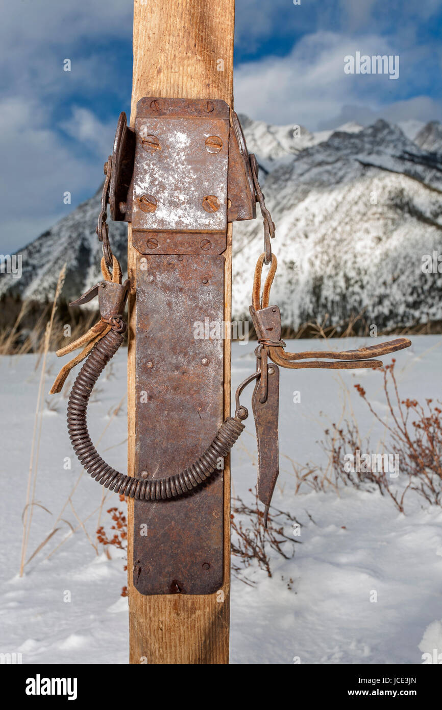 vintage ski bindings closeup with winter scenery in background Stock