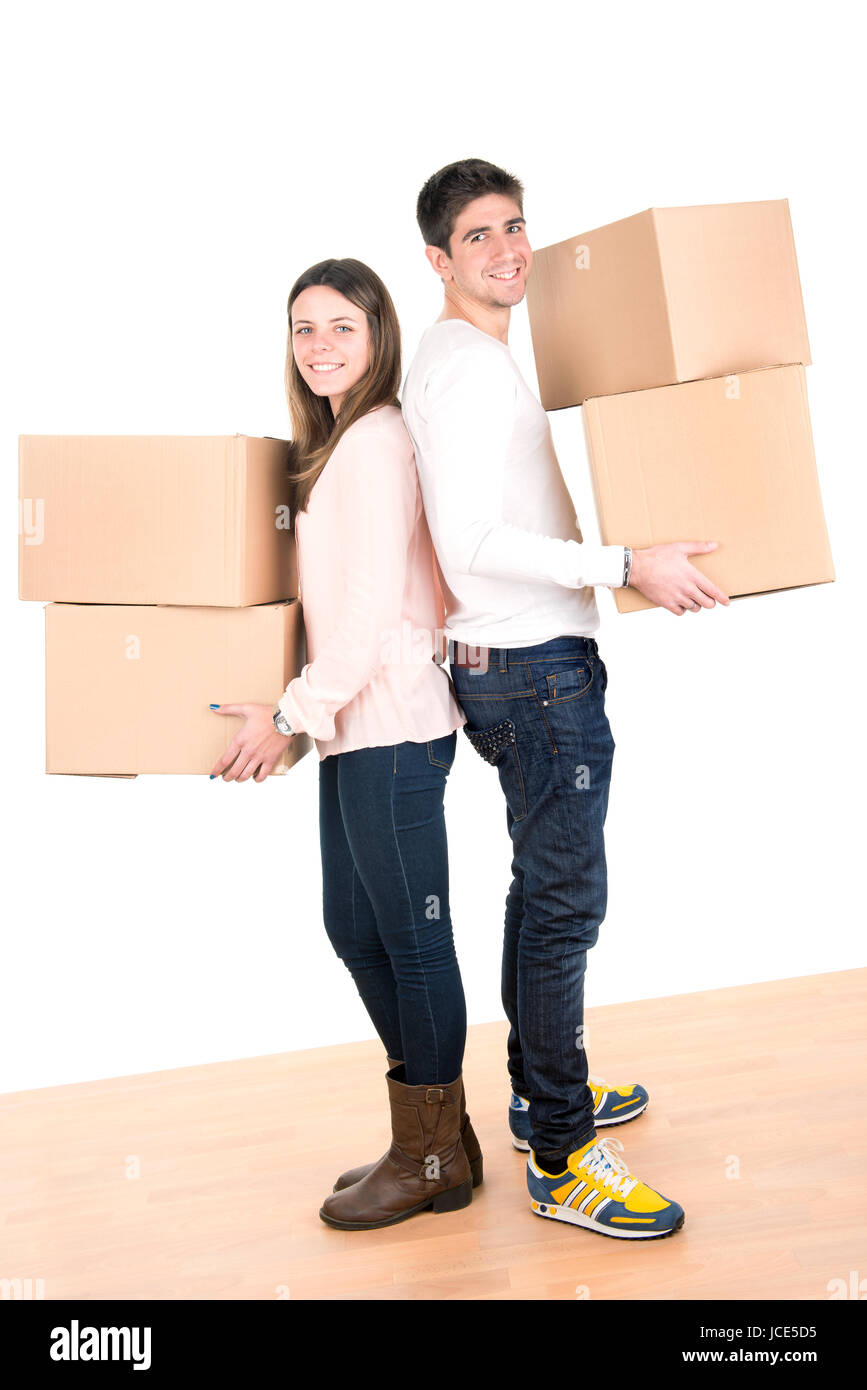 Happy couple with boxes moving into new home apartment Stock Photo - Alamy
