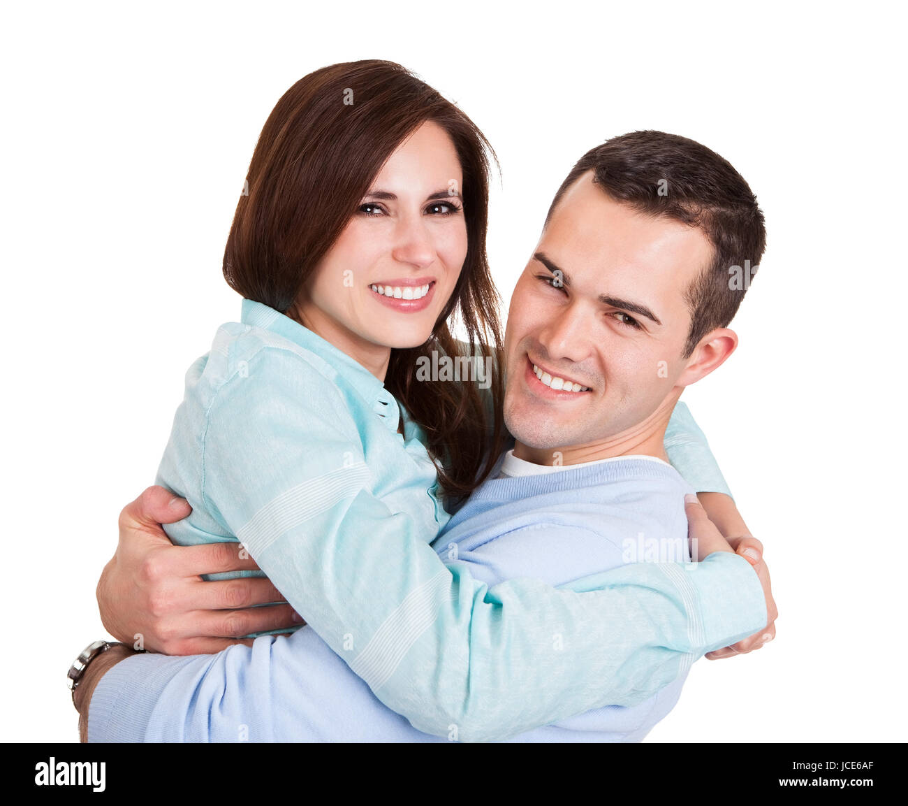 Portrait of beautiful young couple. Isolated on white Stock Photo - Alamy