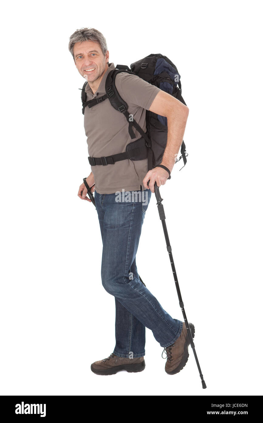 Senior man with backpack and hiking poles. Isolated on white Stock ...