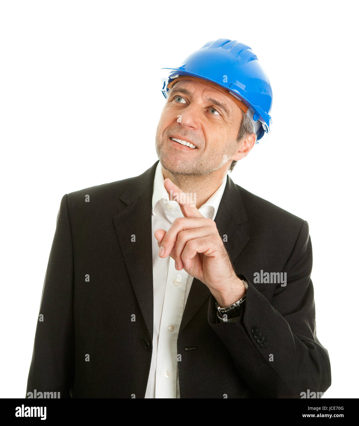 Portrait of successfull architect wearing blue hard hat and pointing