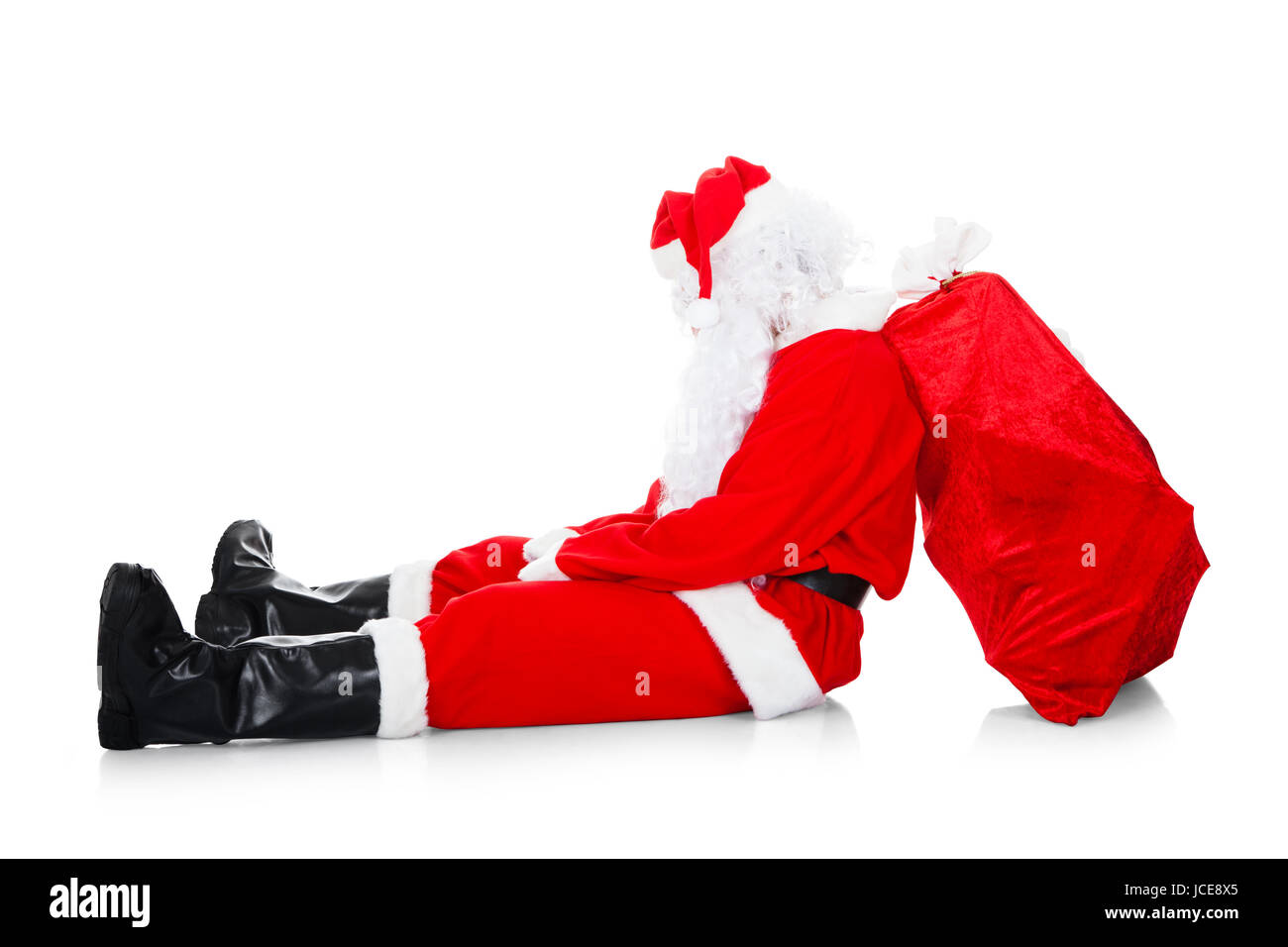 Portrait of tired santa over white background Stock Photo