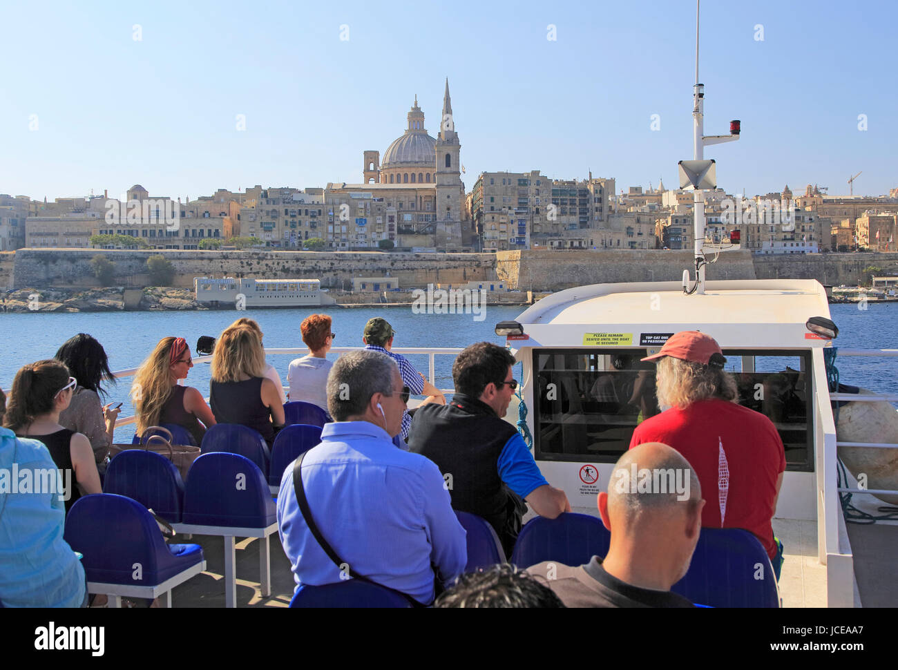 people-onboard-ferry-boat-crossing-harbour-from-sliema-to-valletta