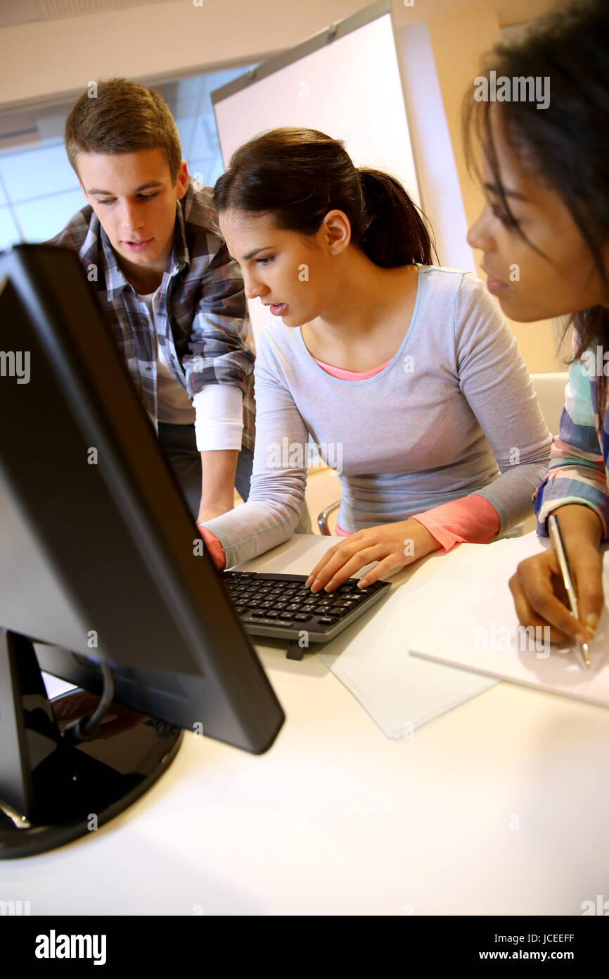 Group of students working in computer lab Stock Photo