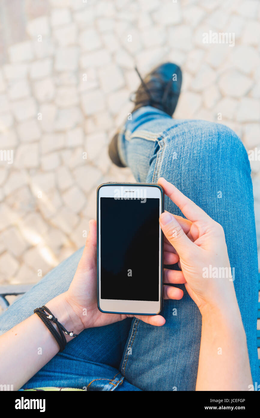 Using Phone Top View Top view of woman use of mobile phone Stock Photo - Alamy