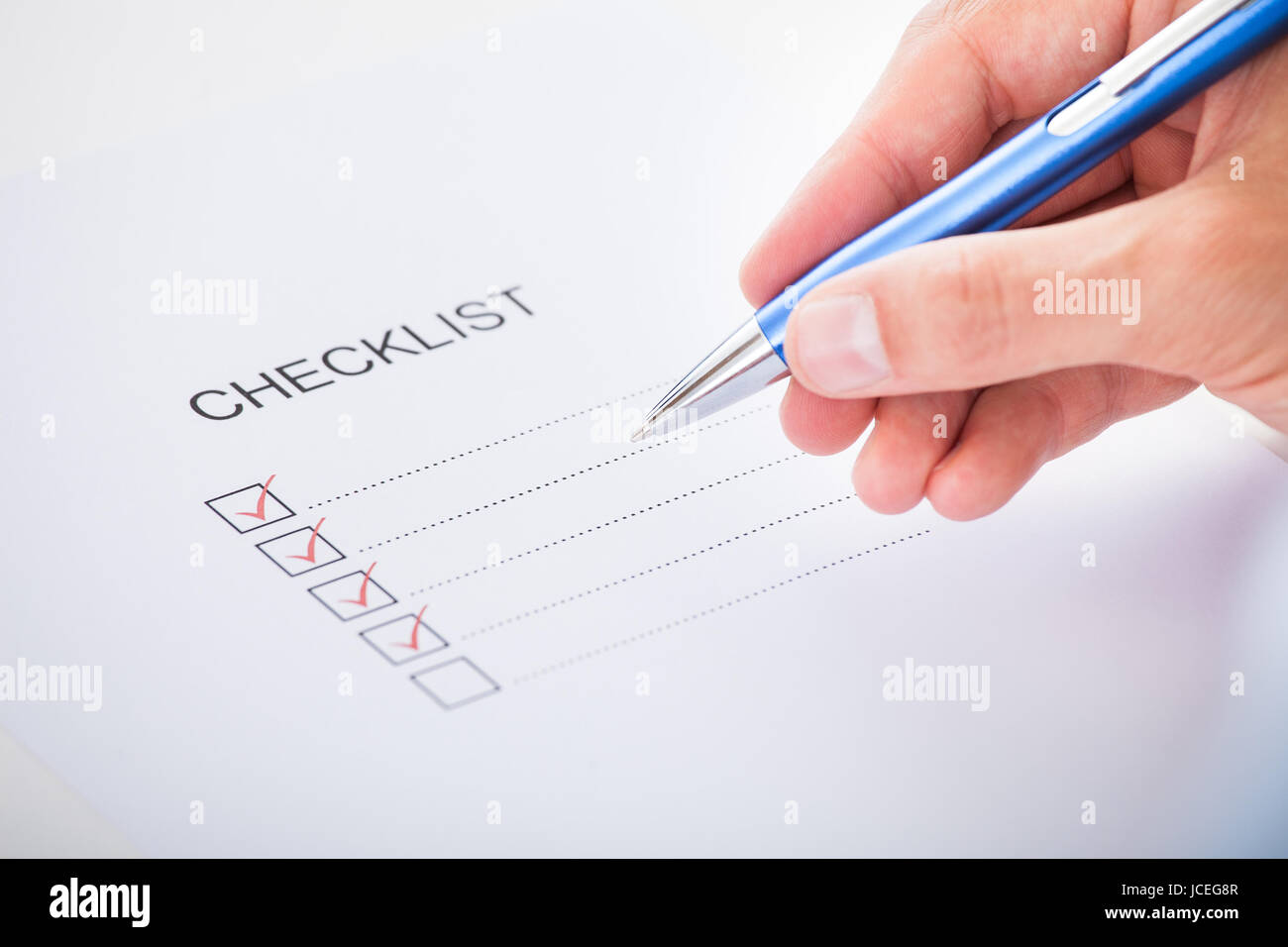 Close-up Of Hand With Red Pen Marking A Check Box Stock Photo - Alamy