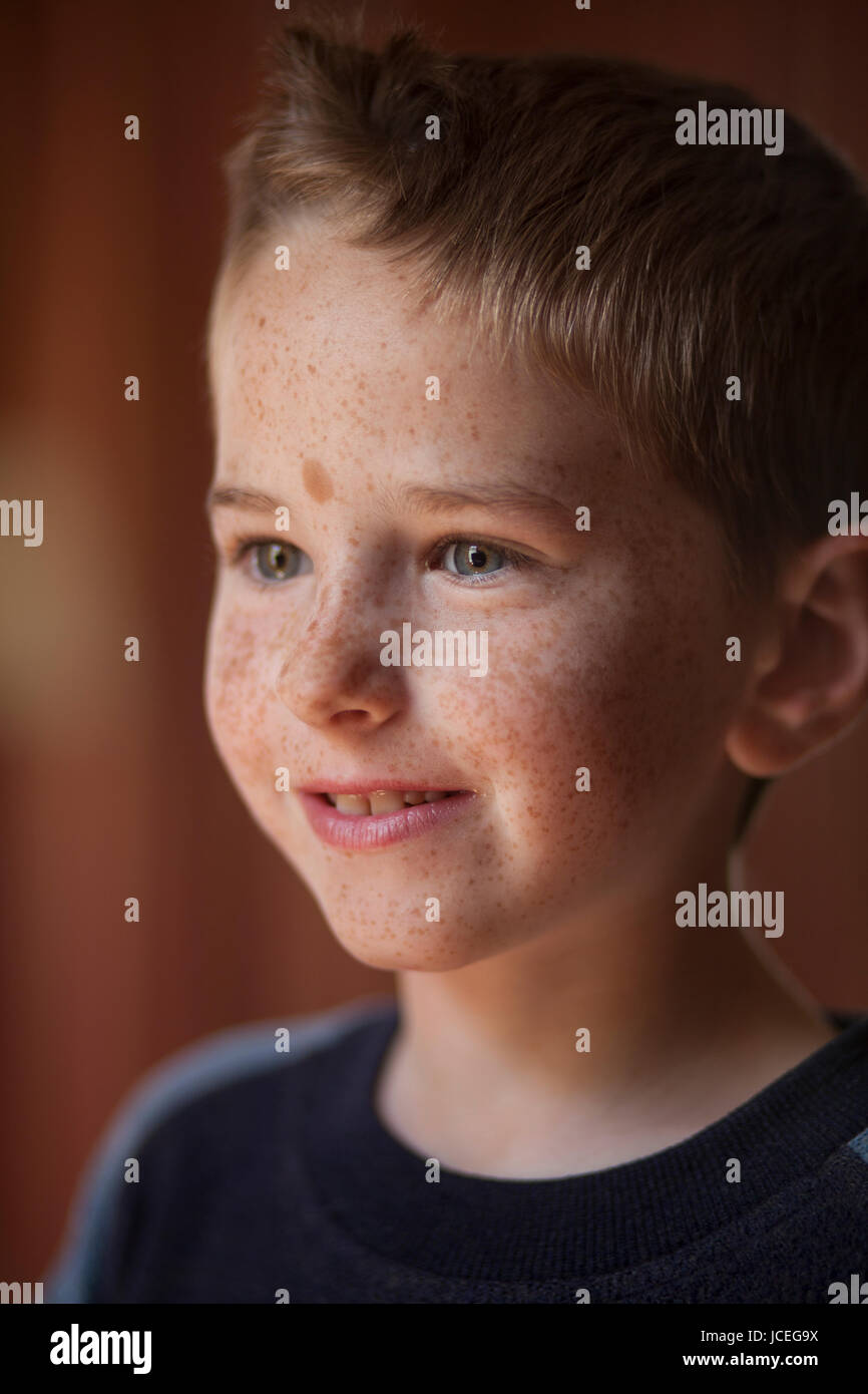 A happy and bright 9 year old boy during a family outing. Stock Photo