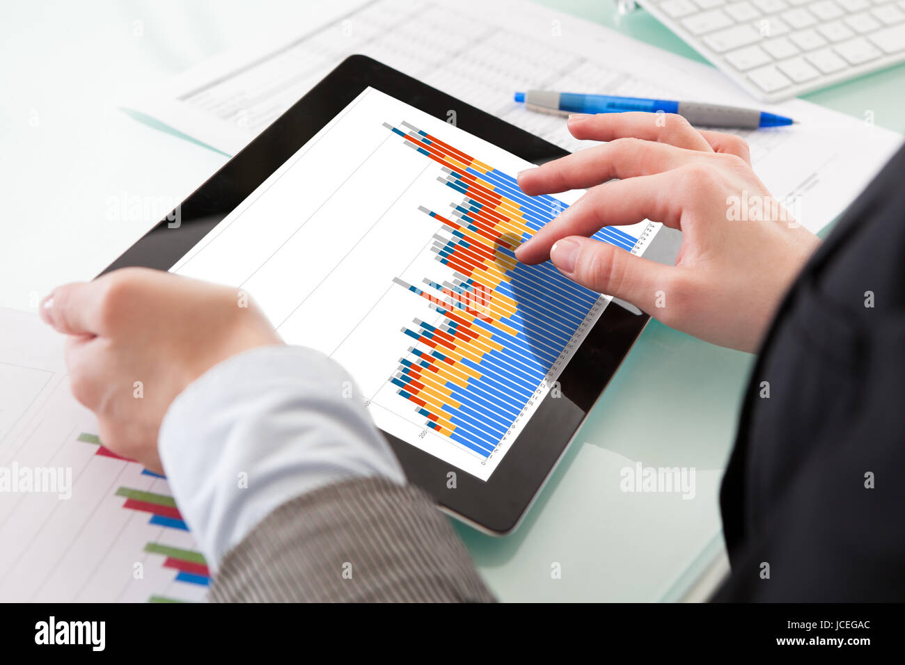 Businessperson Analyzing Graph On Digital Tablet In The Office Stock ...