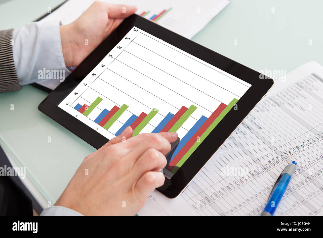 Businessperson Analyzing Graph On Digital Tablet In The Office Stock ...