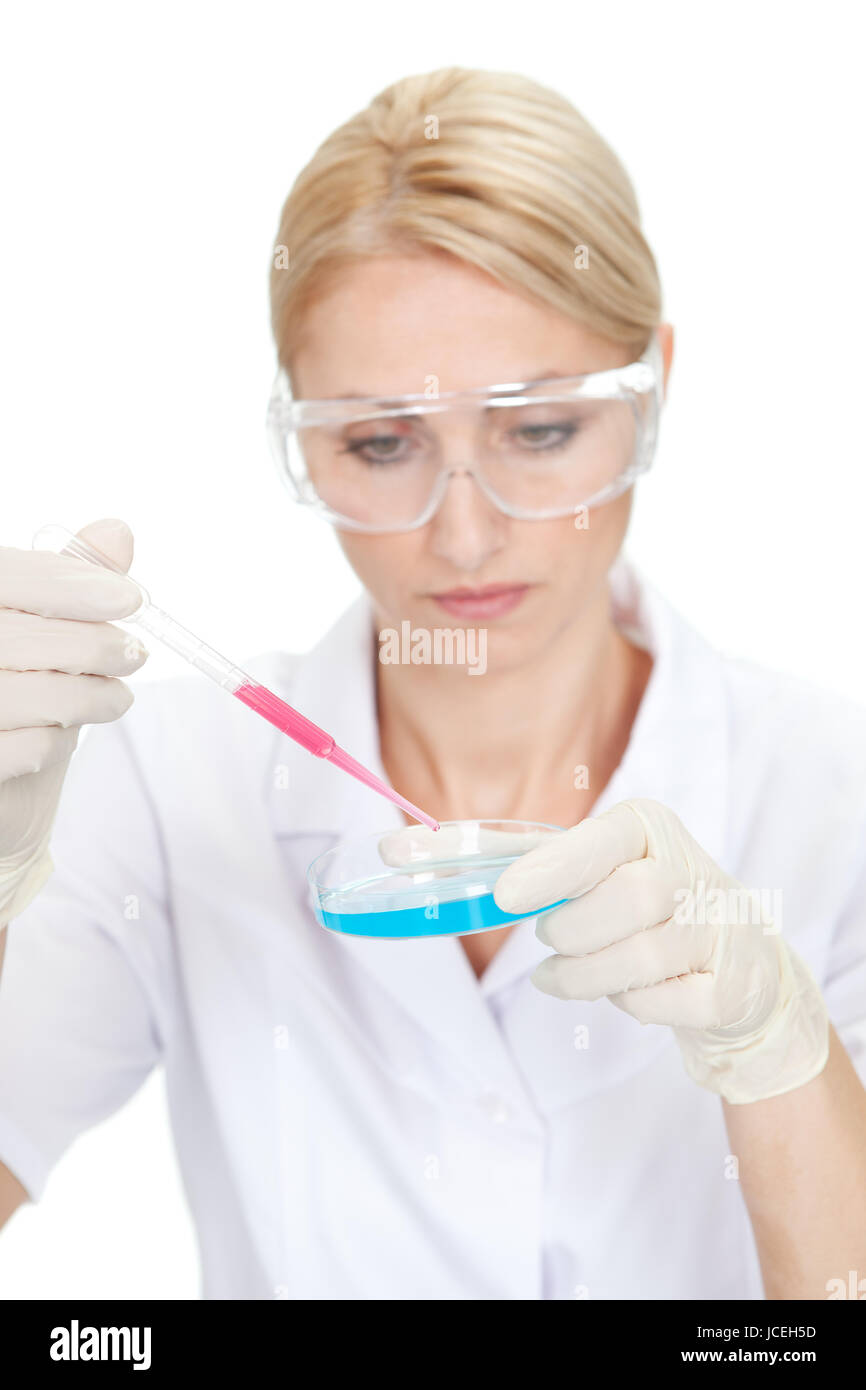 Researcher making an experimenting using petri dishes in laboratory