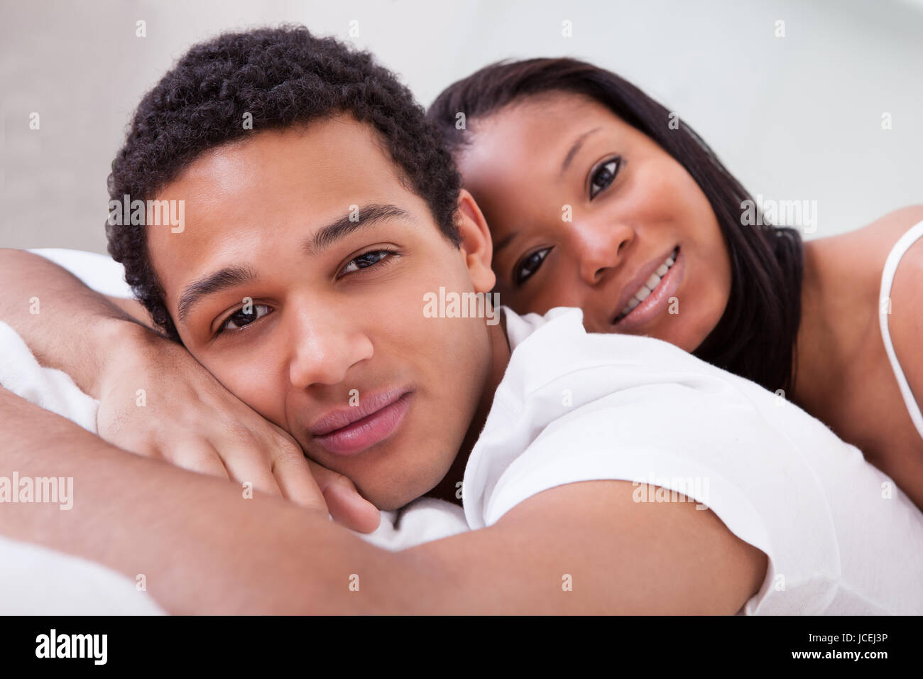 Portrait Of Young African Couple Looking At Camera Stock Photo - Alamy