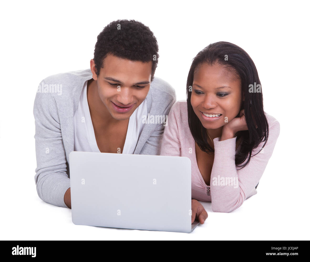 Young Couple Working On Laptop Over White Background Stock Photo - Alamy