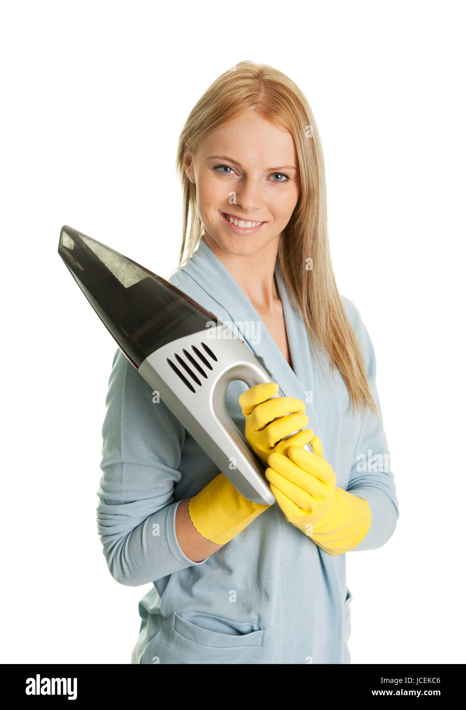 Cheerful woman with handheld vacuum cleaner. Isolated on white Stock