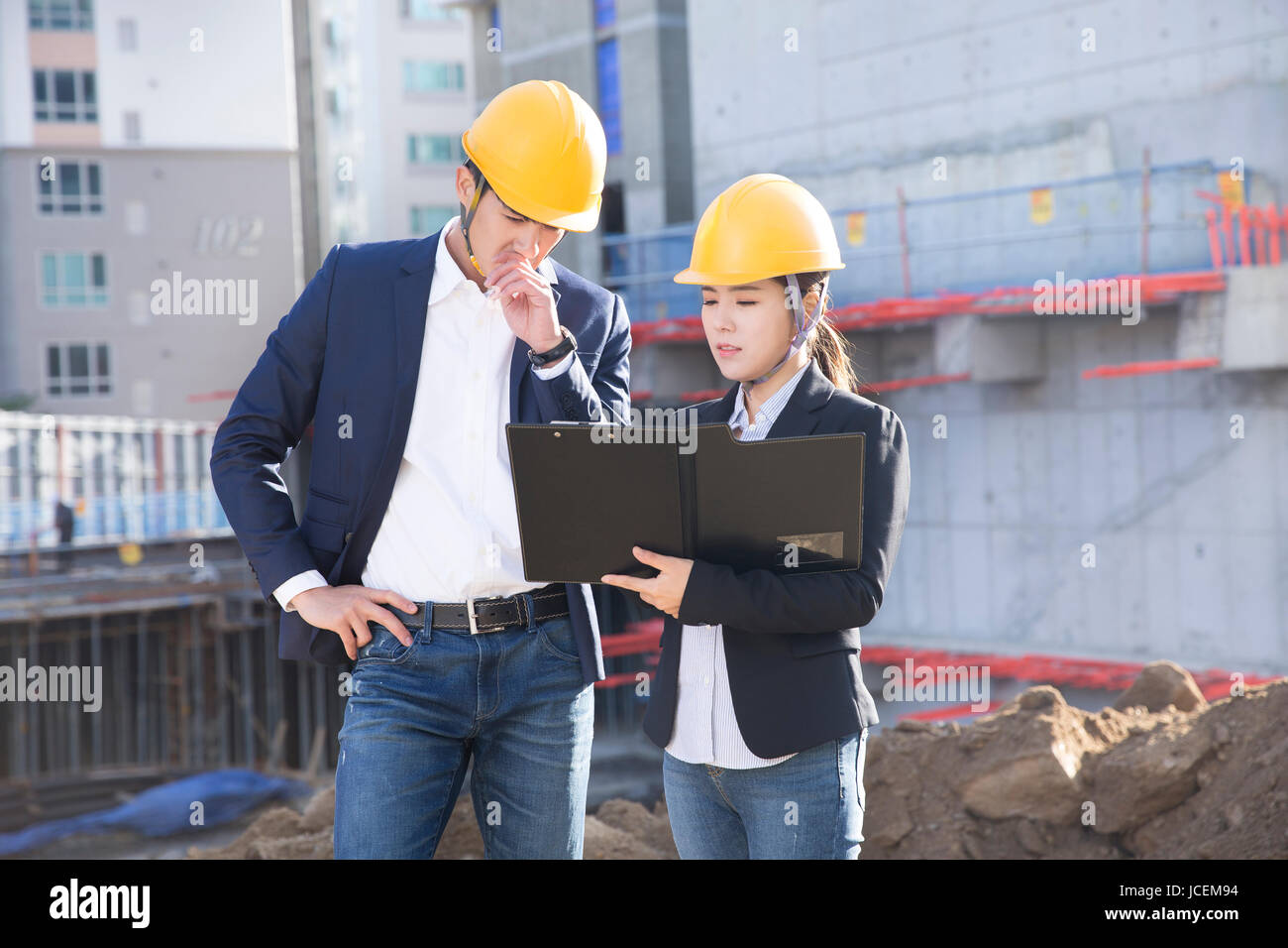 Two architects at construction site Stock Photo