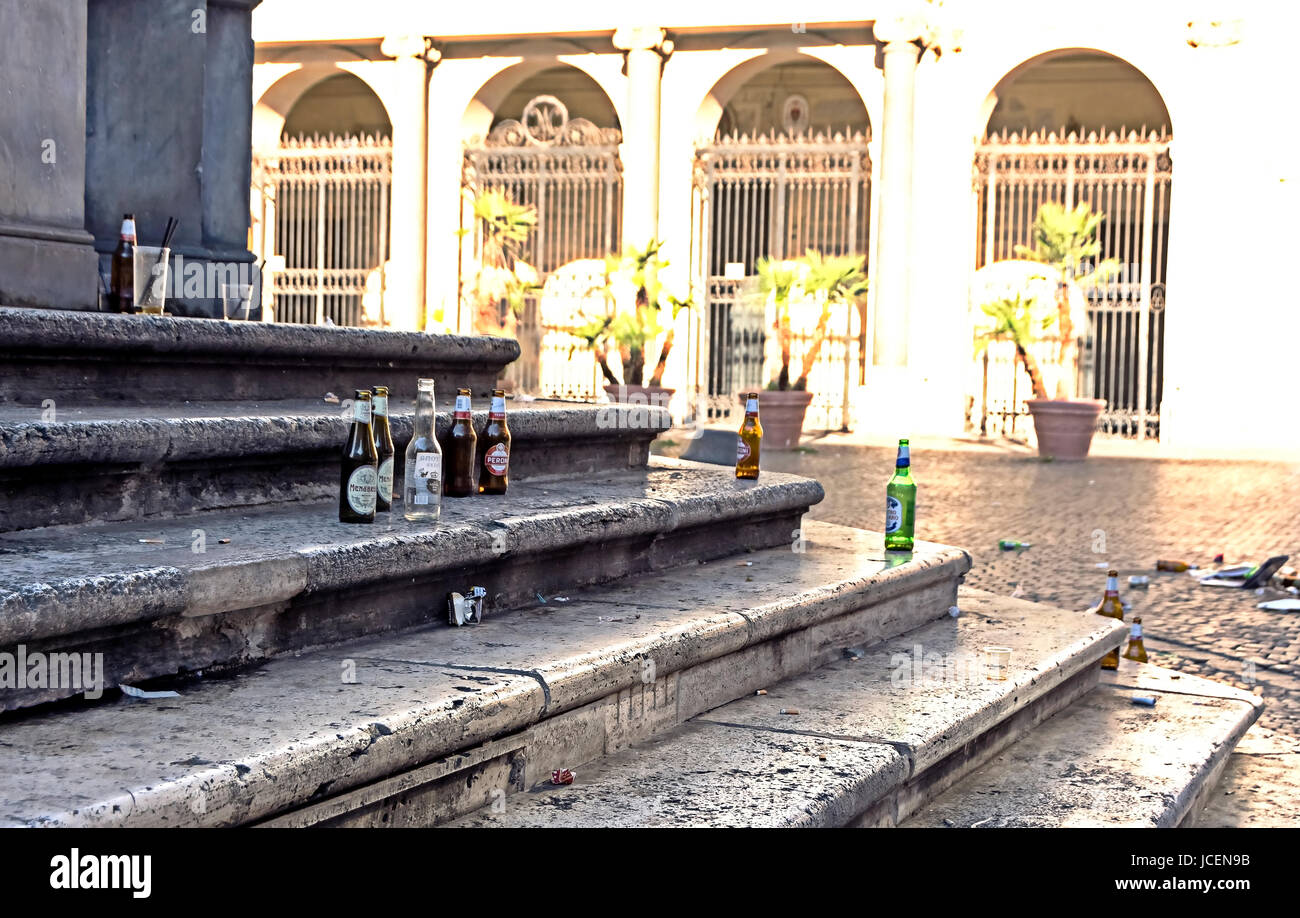 Litter and rubbish left by evening revellers in Piazza Santa Maria in Trastevere, Rome. Stock Photo