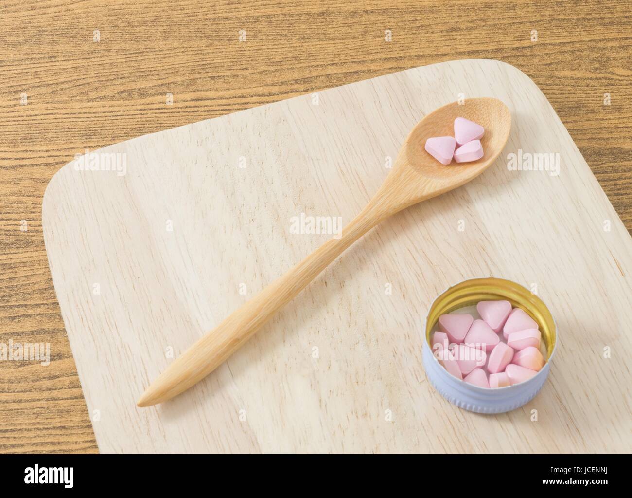 Healthcare Concept, A Wooden Spoon Full with Vitamins Pills on A Tray
