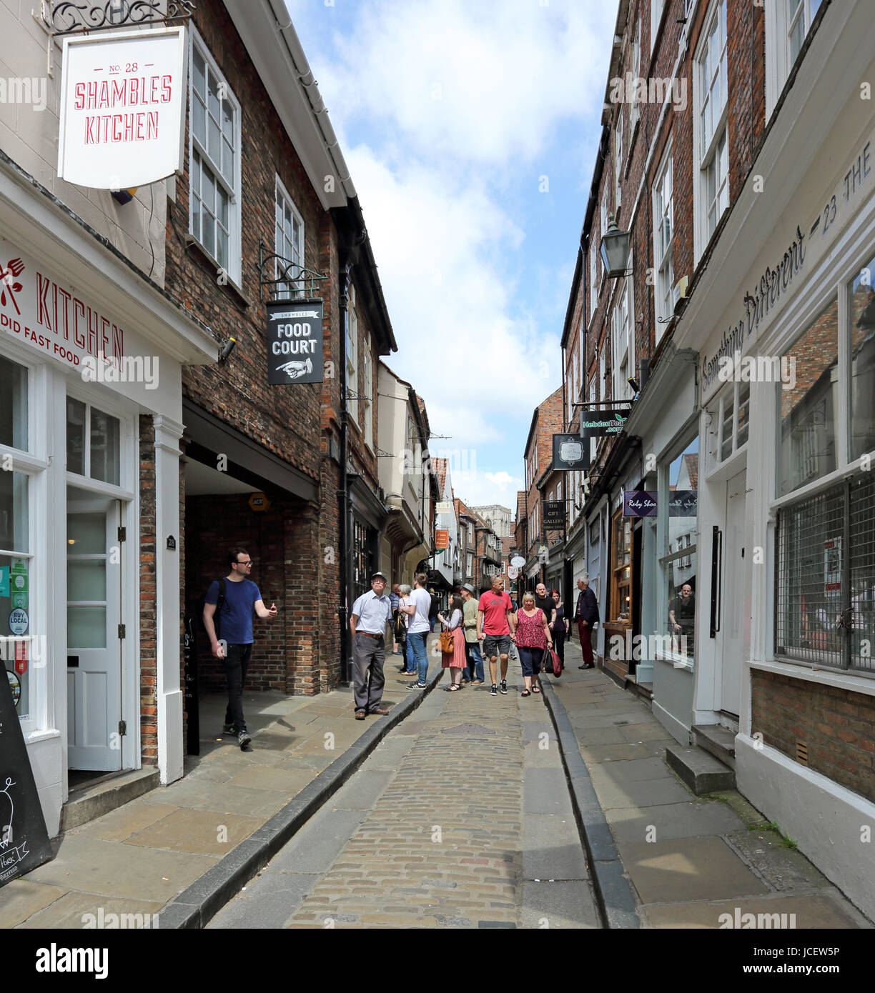Tourists enoying shopping on one of York's famous old cobbled streets, The Shambles. Stock Photo