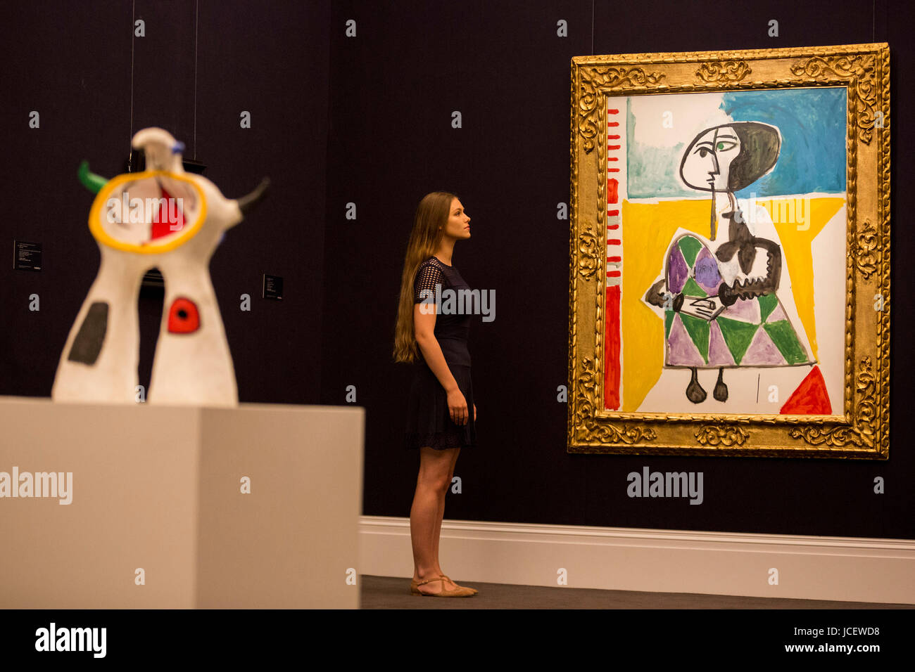 London, UK. 15 June 2017. Painting Femme accroupie by Pablo Picasso, 1954, est. GBP 6.5-8.5m and the sculpture Projet pour un monument by Joan Miro, 1972, est. GBP 800,000-1,200,000.  Auction house Sotheby's presents Landmarks int he Development of Modern Art to lead Sotheby's Impressionist & Modern Art Evening Sale on 21 June 2017. Stock Photo