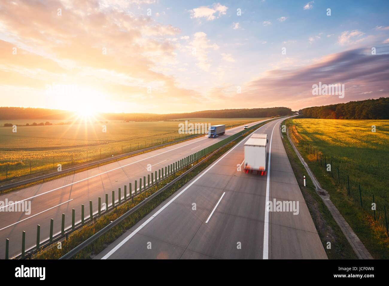 Amazing sunrise on the highway in the middle of the countryside