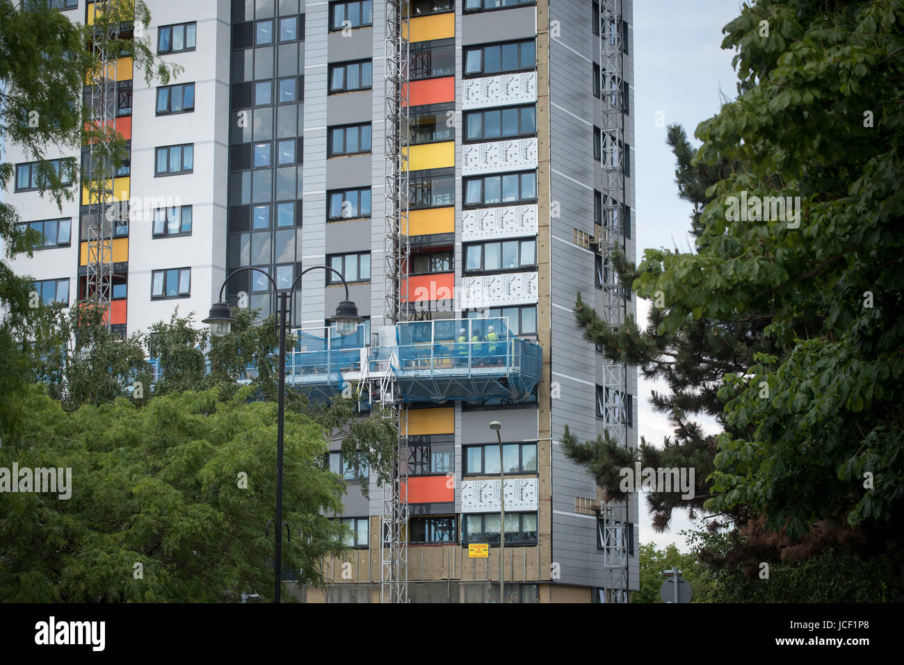 Dangerous flammable cladding panels being removed from on a tower block ...
