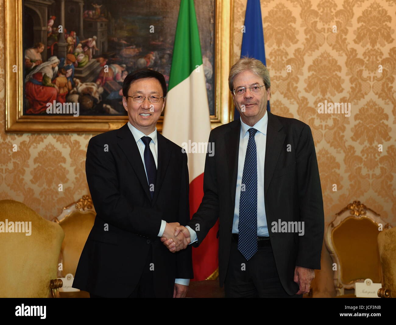 Rome, Italy. 14th June, 2017. Italian Prime Minister Paolo Gentiloni (R) shakes hands with Han Zheng, a member of the Political Bureau of the Central Committee of the Communist Party of China (CPC) and secretary of the CPC Shanghai Municipal Committee, during their meeting in Rome, Italy, on June 14, 2017. Credit: Chen Zhengbao/Xinhua/Alamy Live News Stock Photo