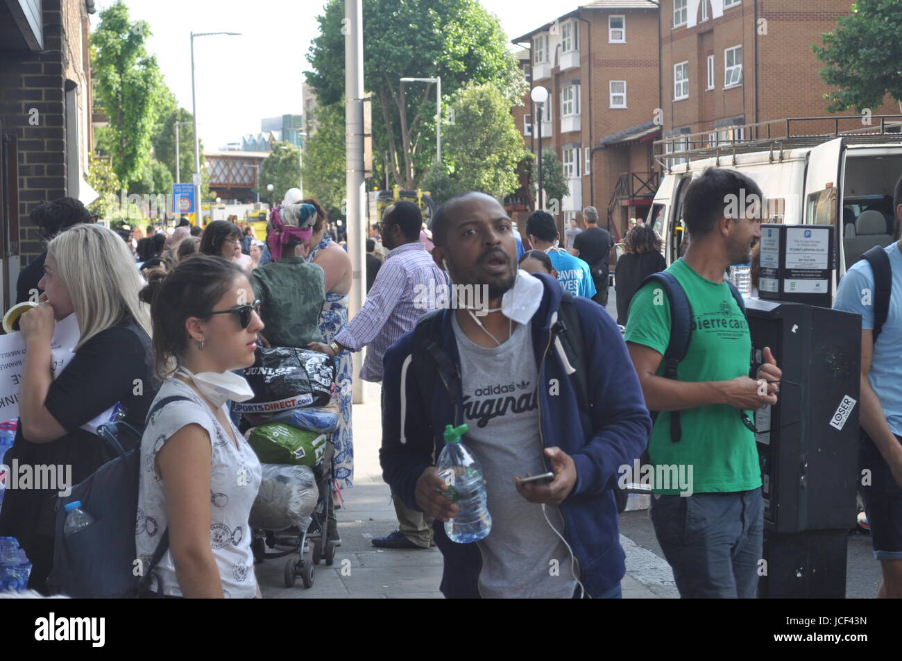 Noel Clarke and his partner as they help out amid the aftermath of the fire in Grenfell tower the night before Stock Photo