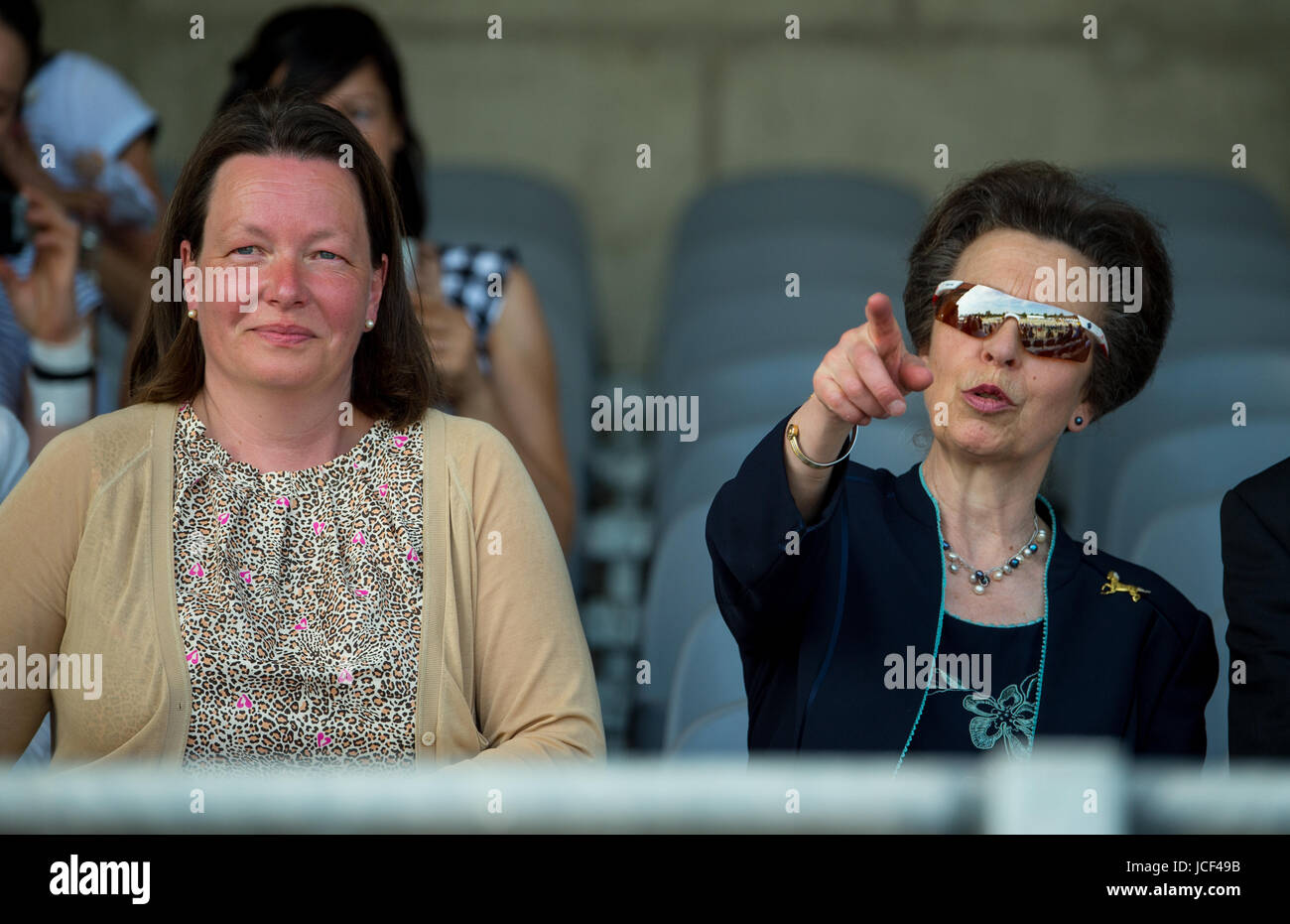 Luhmuehlen, Germany. 15th June, 2017. The British princess Anne watches a children's equestrian competition next to the chairwoman of the tourney company Luhmuehlen GmbH, Julia Otto (L), in Luhmuehlen, Germany, 15 June 2017. She has been patron to the traditional tourney in the Lueneburger Heide region, south of Hamburg. Photo: Philipp Schulze/dpa/Alamy Live News Stock Photo