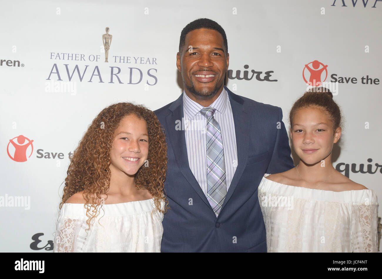 New York, NY, USA. 15th June, 2017. Michael Strahan and his twin daughter's Isabella and Sophia attend the the 76th Annual Father of the Year Awards luncheon, on Thursday, June 15, 2017 at the New York Hilton Hotel. Credit: Raymond Hagans/Media Punch/Alamy Live News Stock Photo