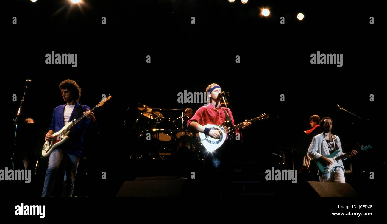 Dire Straits, Hammersmith Odeon, December 1985 Dire Straits were a British rock band that formed in Deptford, London, in 1977 by Mark Knopfler (lead vocals and lead guitar), his younger brother David Knopfler (rhythm guitar and backing vocals), John Illsley (bass guitar and backing vocals), and Pick Withers (drums and percussion). Dire Straits' sound drew from a variety of musical influences, including jazz, folk, and blues, and came closest to beat music within the context of rock and roll. name:  Date:  Event: location: Stock Photo