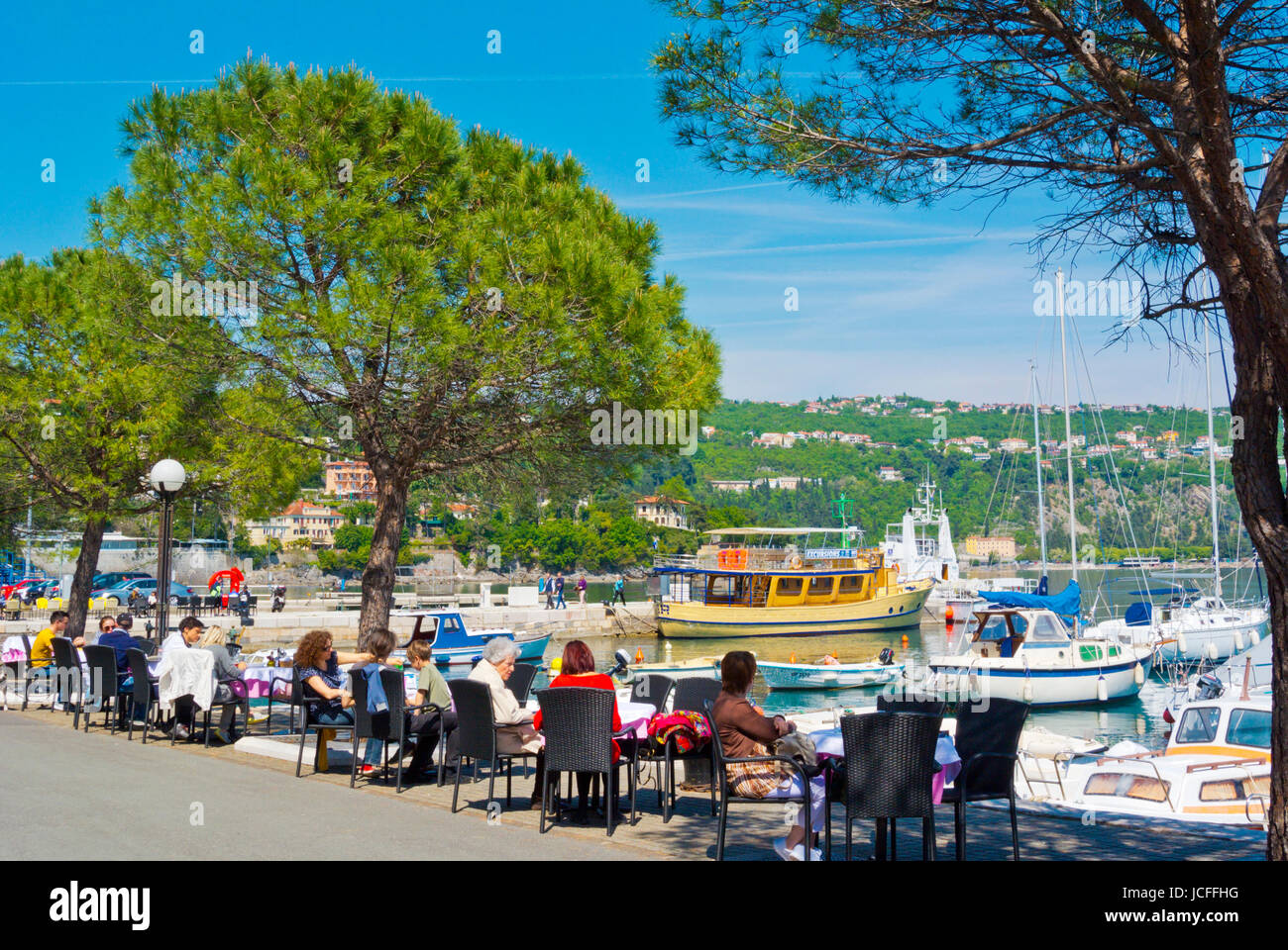 Cafe terrace, at Volosko lucica, marina, Volosko, a district of Opatija, Kvarner Bay, Croatia Stock Photo