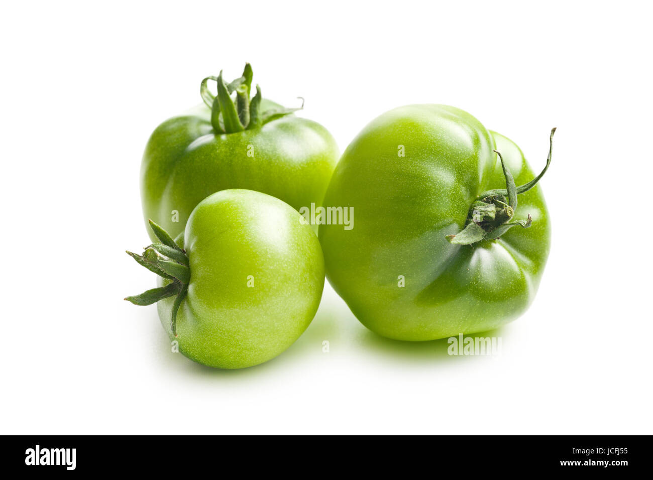green tomatoes on white background Stock Photo - Alamy