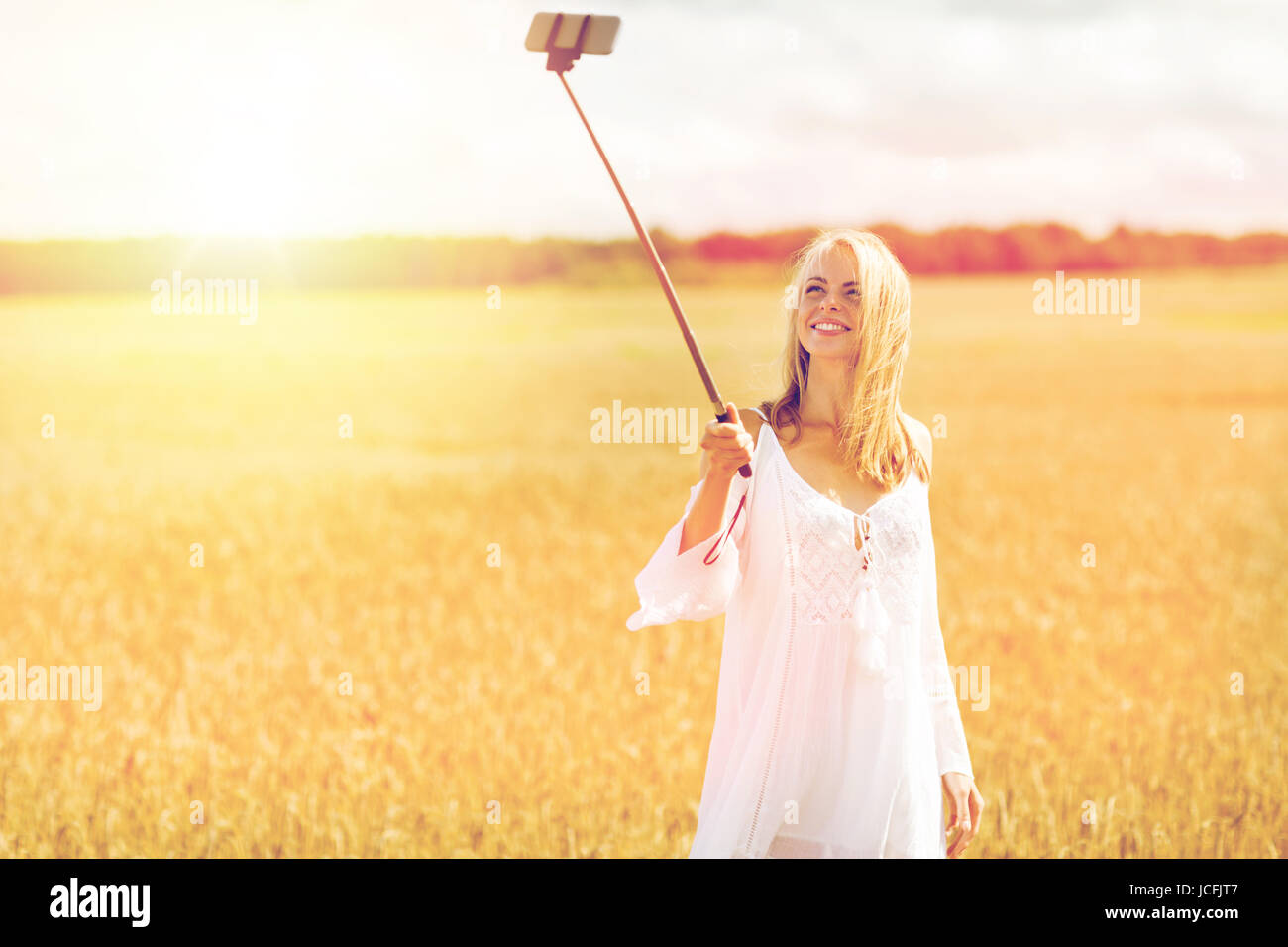 happy young woman taking selfie by smartphone Stock Photo - Alamy