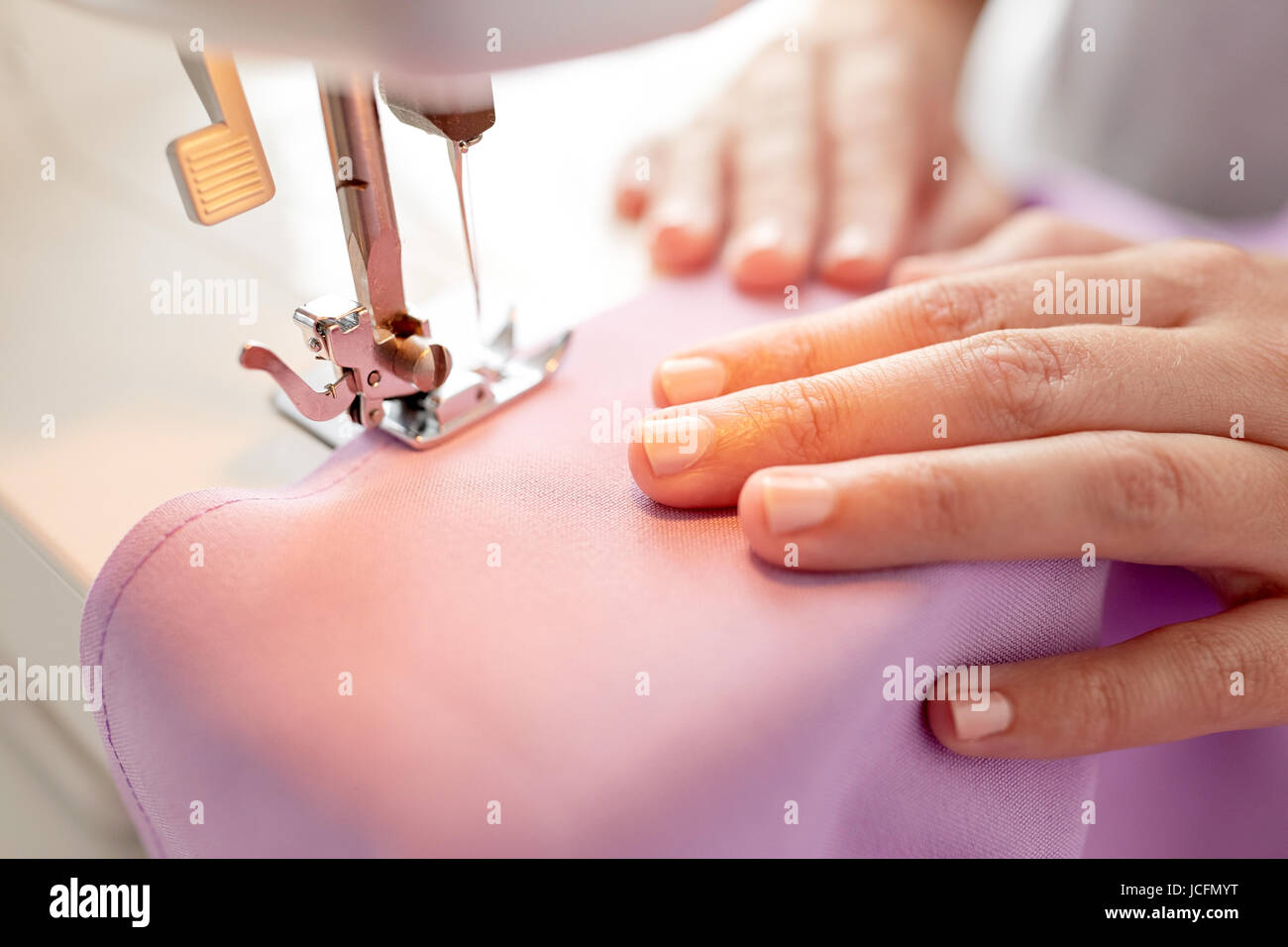 sewing machine presser foot stitching fabric Stock Photo Alamy